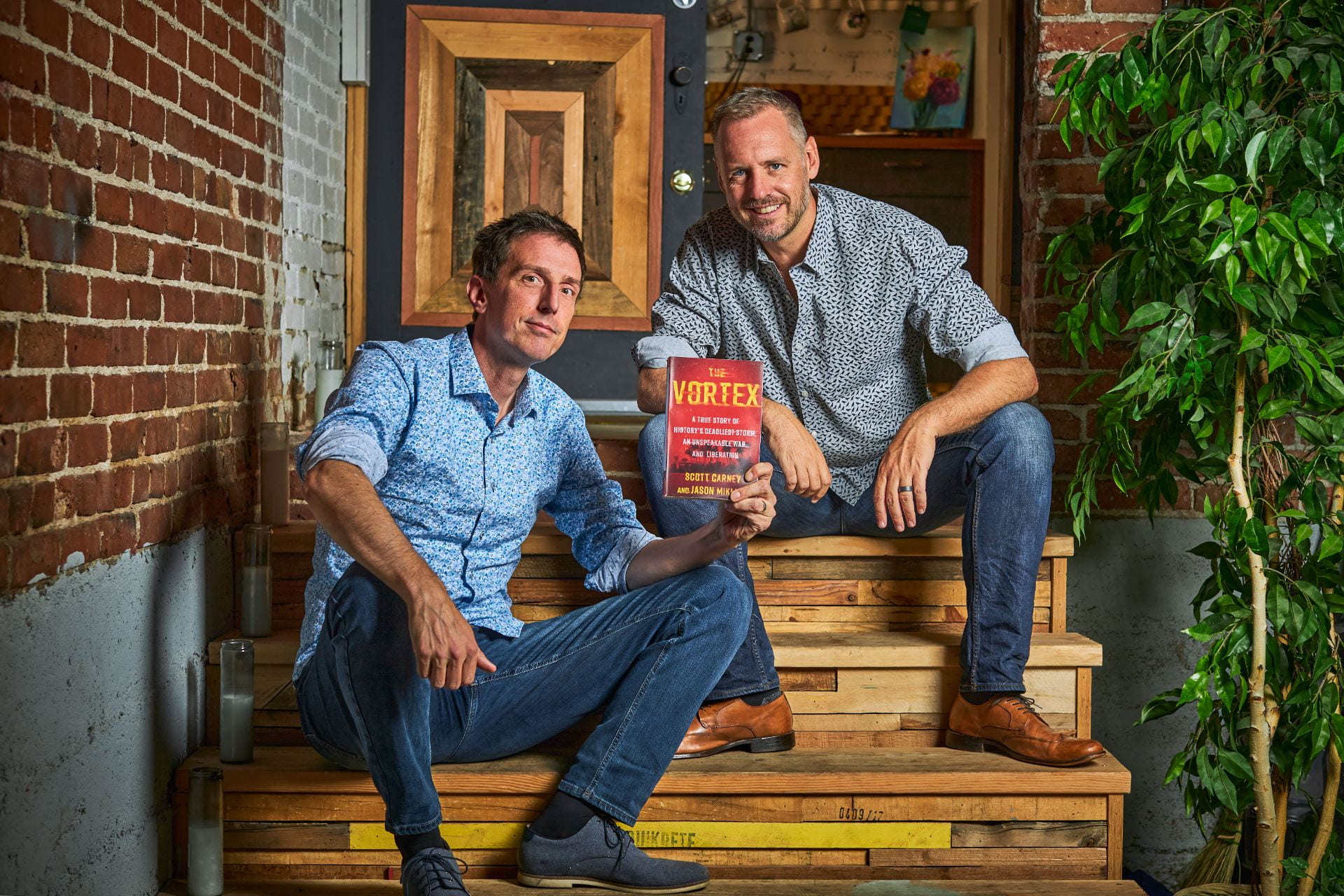 Picture of Jason and Scott holding their newbook