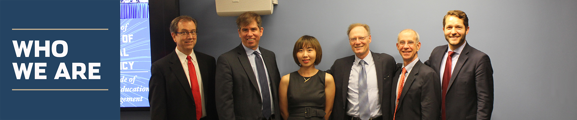 "Who We Are" six members of the Institute for International Economic Policy standing side by side. 