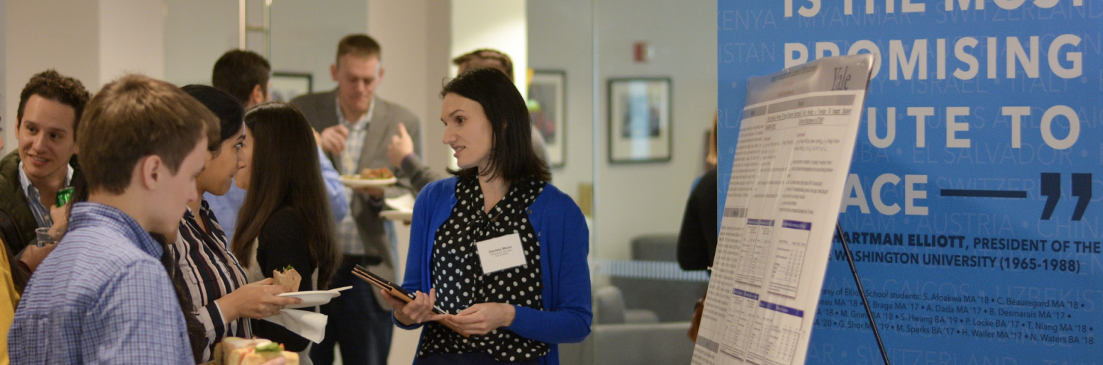 IIEP Event. Students, staff, and faculty browsing posters.